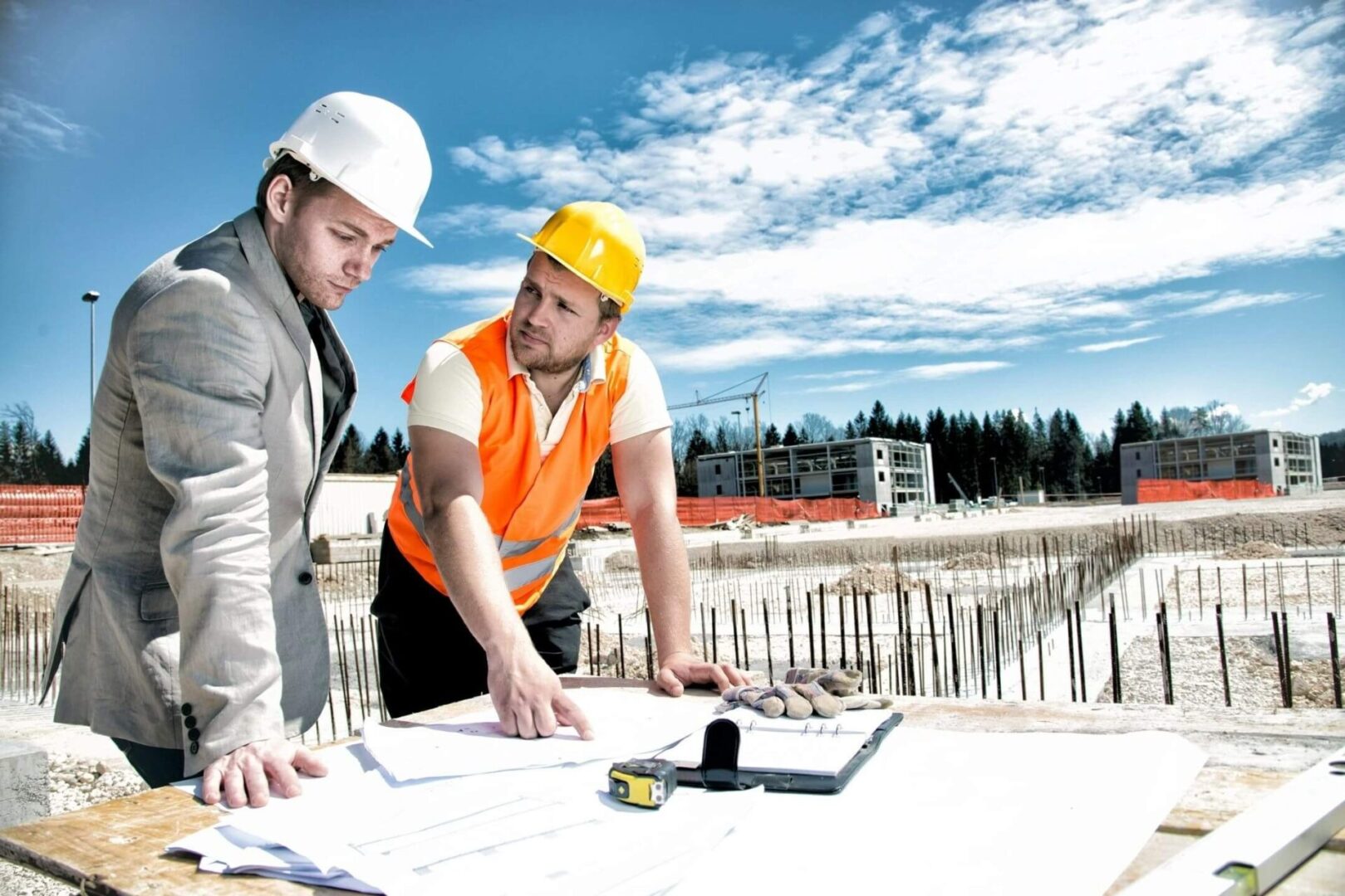 Architect and engineer reviewing plans